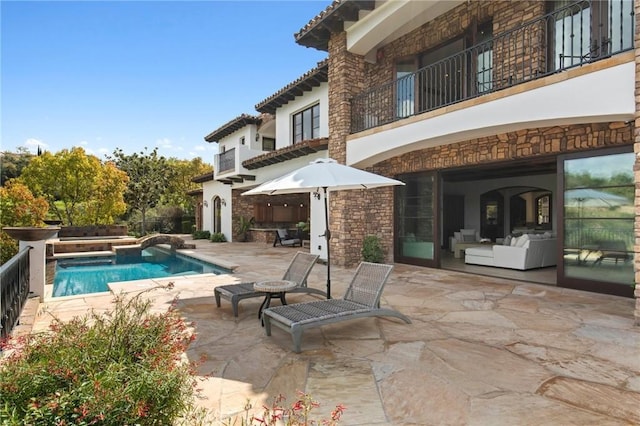 exterior space featuring a patio area and outdoor lounge area