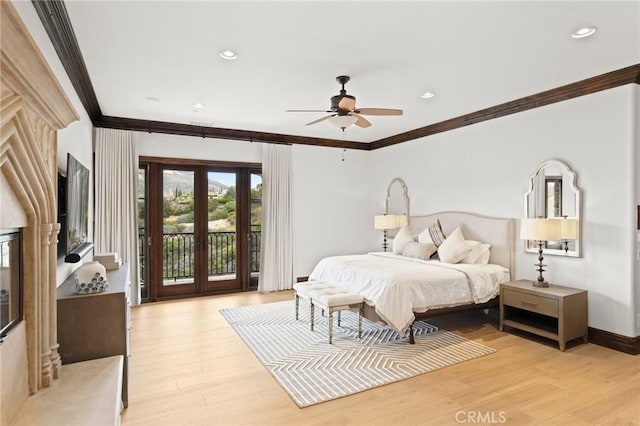 bedroom with french doors, light hardwood / wood-style floors, access to exterior, ceiling fan, and crown molding