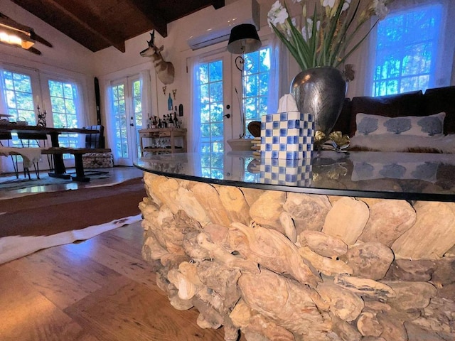 bar featuring hardwood / wood-style floors, wooden ceiling, vaulted ceiling with beams, french doors, and an AC wall unit