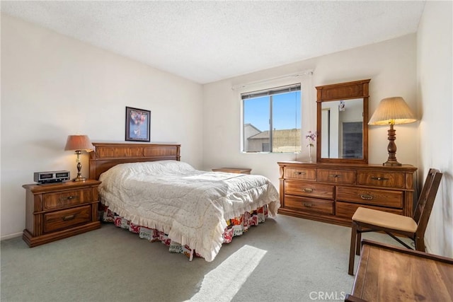 carpeted bedroom with a textured ceiling