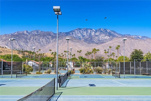 view of sport court with a mountain view and basketball court