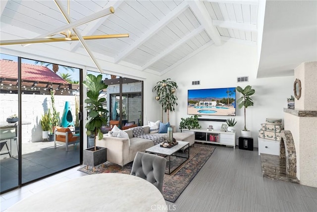 interior space featuring beam ceiling and high vaulted ceiling