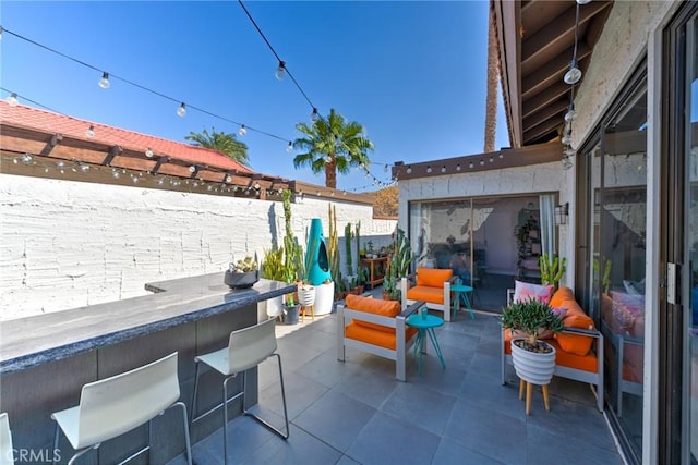 view of patio / terrace featuring an outdoor bar