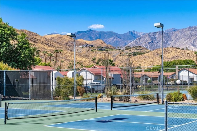 view of sport court with a mountain view