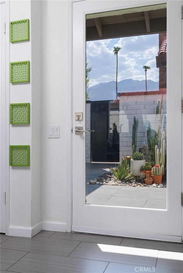 doorway to property with a mountain view