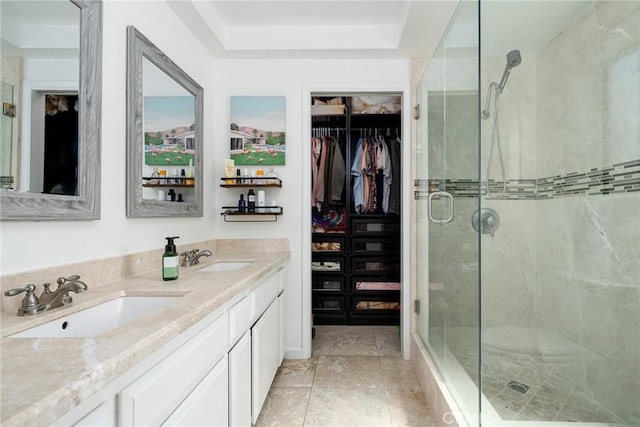 bathroom featuring vanity and an enclosed shower