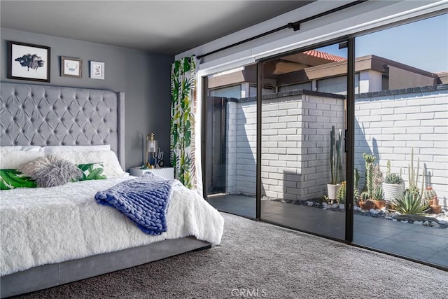 carpeted bedroom featuring access to outside