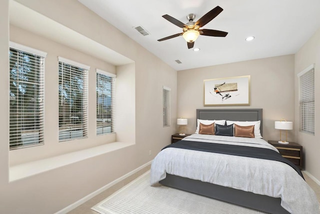 bedroom featuring ceiling fan and carpet