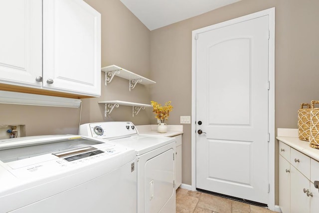 laundry area with cabinets and independent washer and dryer