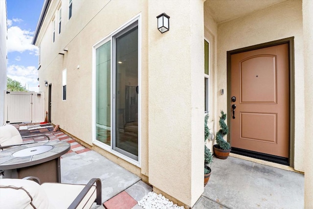 doorway to property featuring a patio