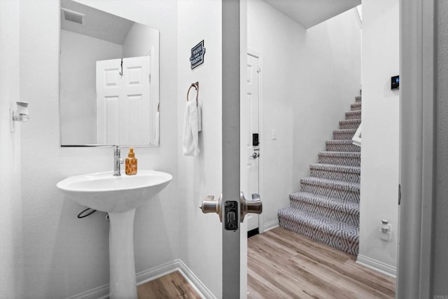 bathroom featuring hardwood / wood-style floors