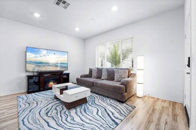 living room with light hardwood / wood-style floors