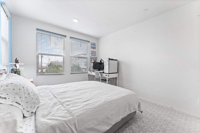 bedroom with light colored carpet