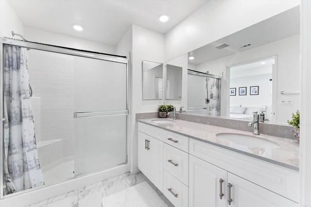 bathroom featuring a shower and vanity