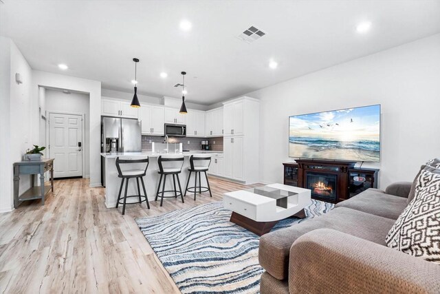 living room with light hardwood / wood-style floors