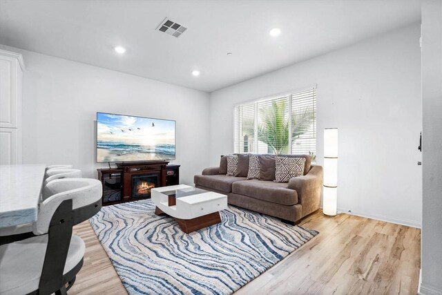 living room with light hardwood / wood-style floors