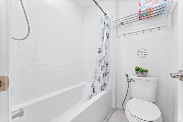 bathroom with shower / bath combination with curtain, toilet, and tile patterned flooring