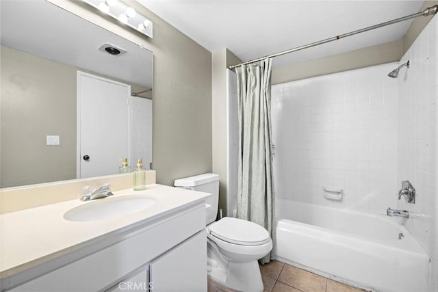 full bathroom featuring toilet, vanity, tile patterned flooring, and shower / bath combination with curtain