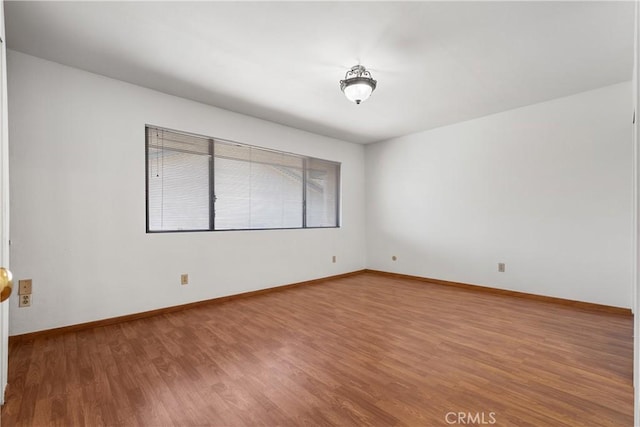 empty room featuring wood-type flooring