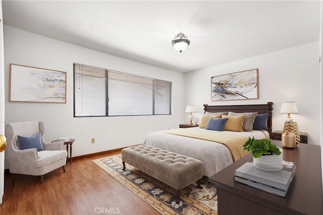 bedroom with hardwood / wood-style flooring