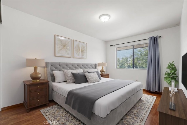 bedroom featuring dark hardwood / wood-style floors