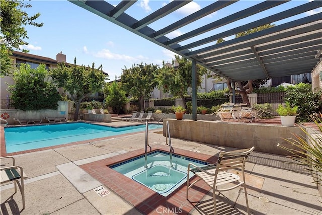 view of pool with a pergola, a community hot tub, and a patio