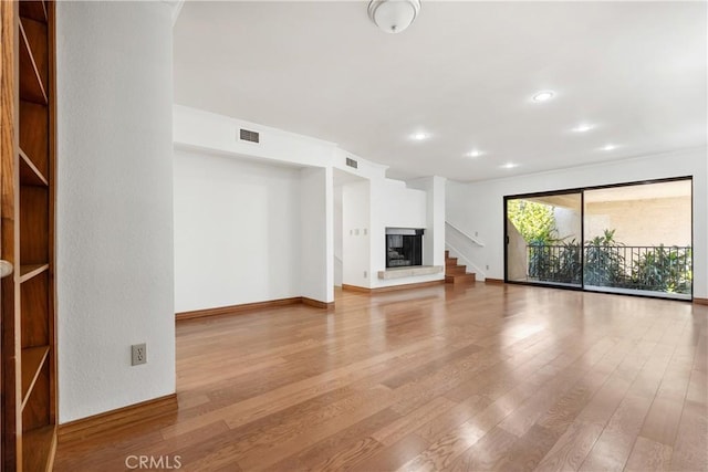 unfurnished living room with light wood-type flooring