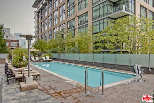 view of swimming pool featuring a patio