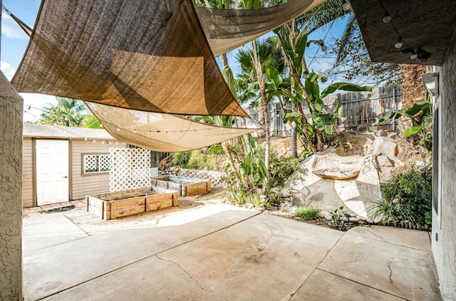 view of patio / terrace featuring an outbuilding