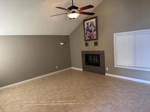 unfurnished living room featuring ceiling fan, light tile patterned floors, and lofted ceiling