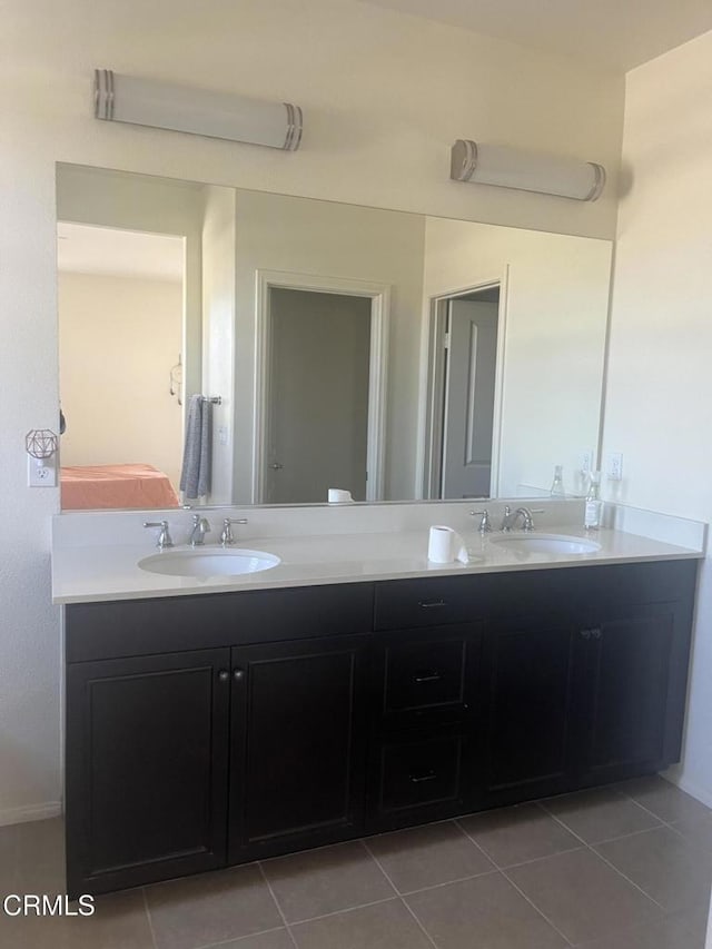 bathroom featuring tile patterned flooring and vanity