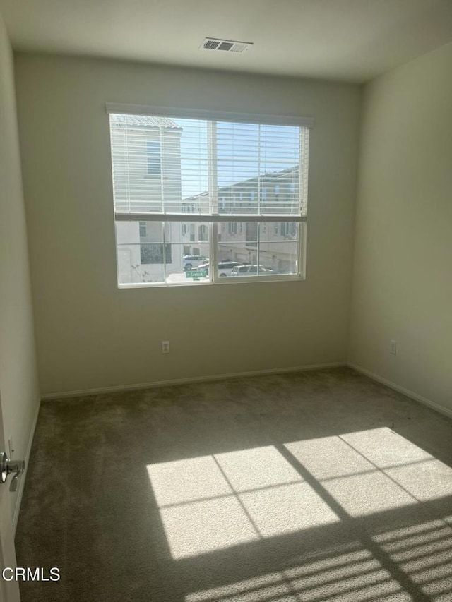 view of carpeted spare room