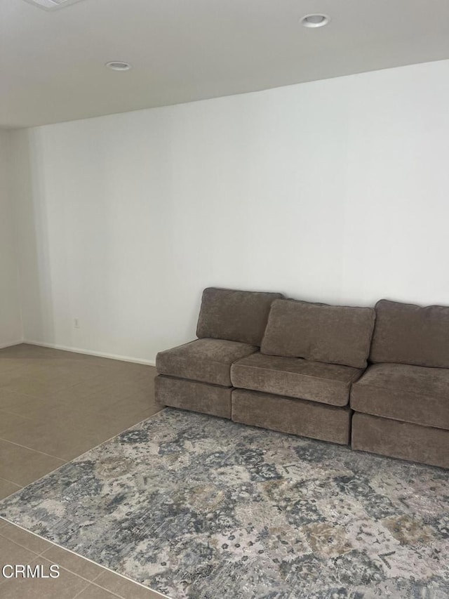 living room with tile patterned floors