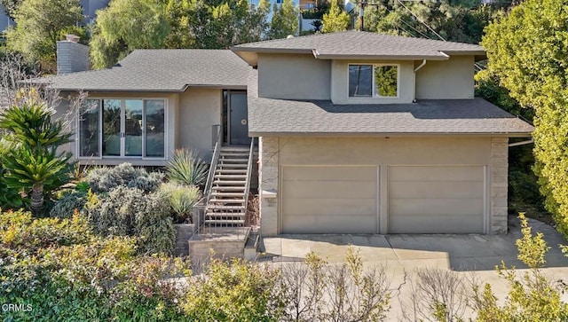 view of front of property with a garage