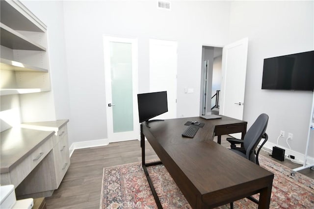 office space featuring dark hardwood / wood-style flooring