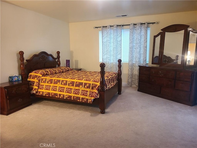 bedroom featuring carpet and visible vents