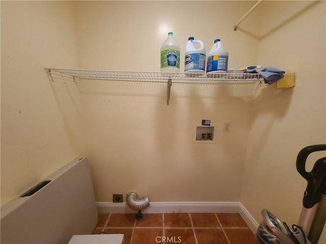 clothes washing area featuring laundry area, baseboards, tile patterned floors, hookup for a washing machine, and electric dryer hookup