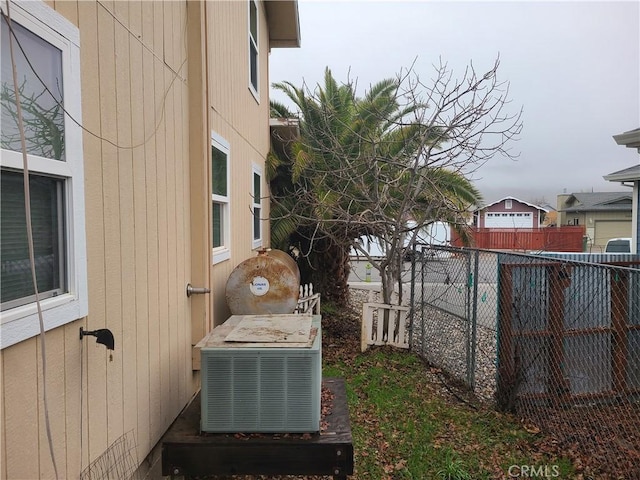 view of yard featuring a fenced backyard and central AC