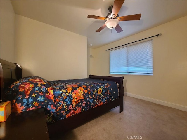 bedroom with carpet, ceiling fan, and baseboards