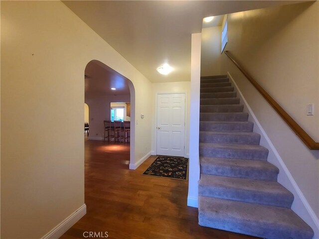 stairs with wood-type flooring