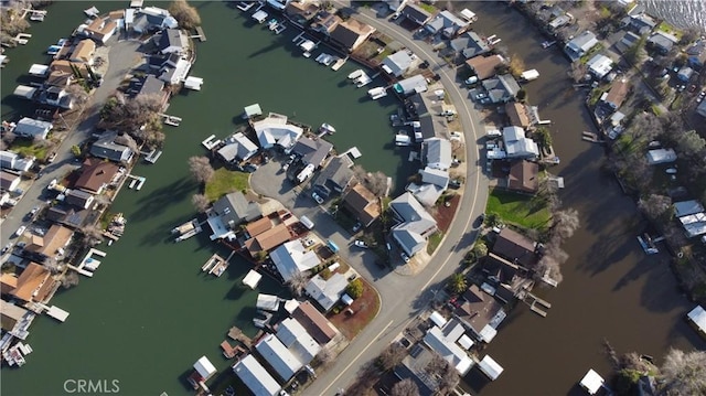 bird's eye view with a residential view and a water view