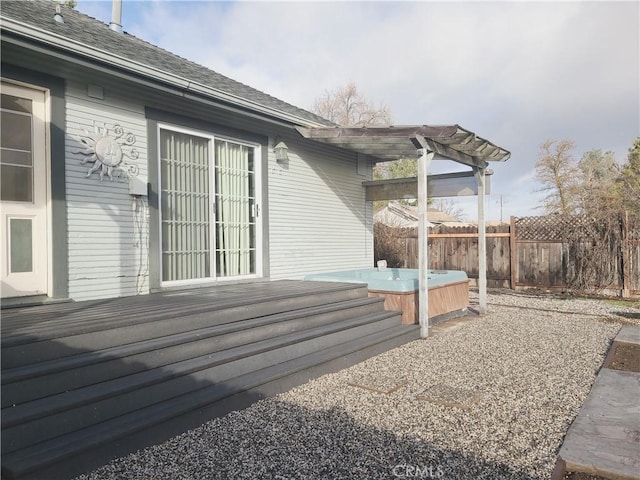 deck with a hot tub