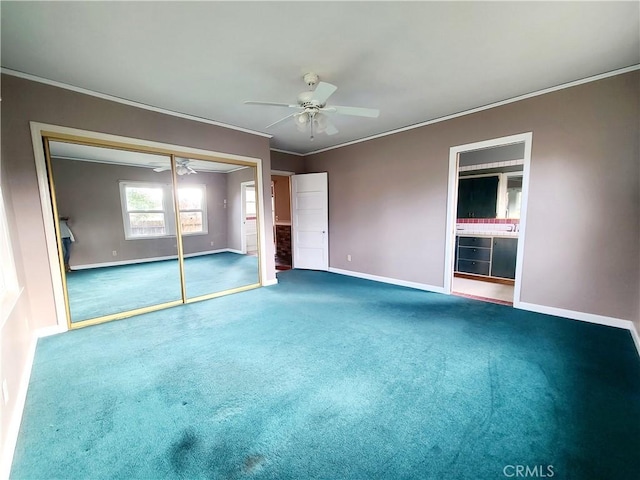 unfurnished bedroom featuring carpet flooring, ornamental molding, ceiling fan, and a closet