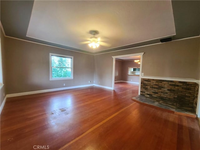 unfurnished living room featuring ceiling fan and hardwood / wood-style floors