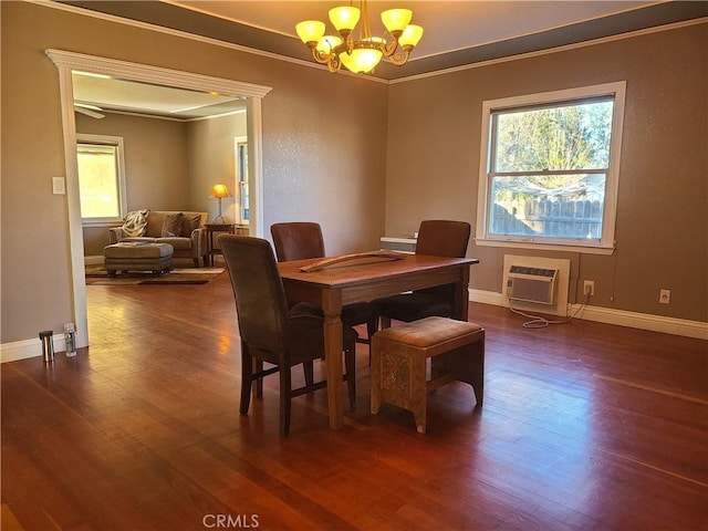 dining area with crown molding, a notable chandelier, a wall mounted air conditioner, and dark hardwood / wood-style floors