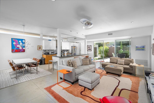 living room with a notable chandelier