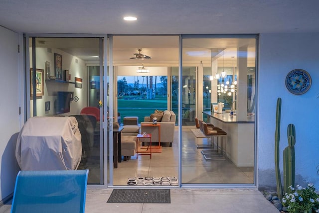 living room featuring expansive windows and an inviting chandelier