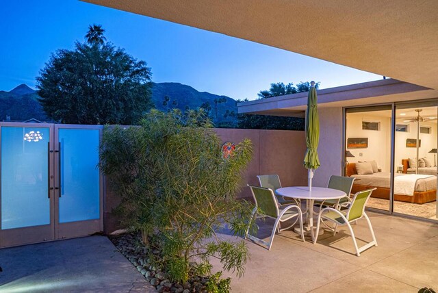 view of patio / terrace featuring a mountain view