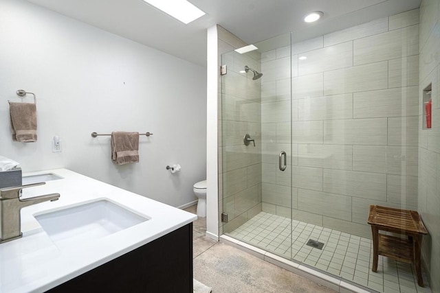 bathroom with toilet, a shower with door, and vanity