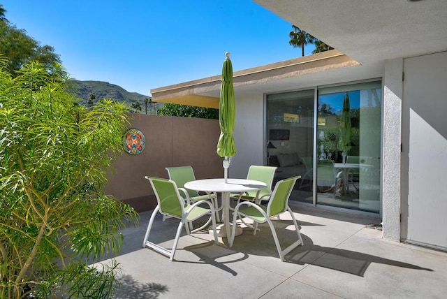 view of patio / terrace with a mountain view